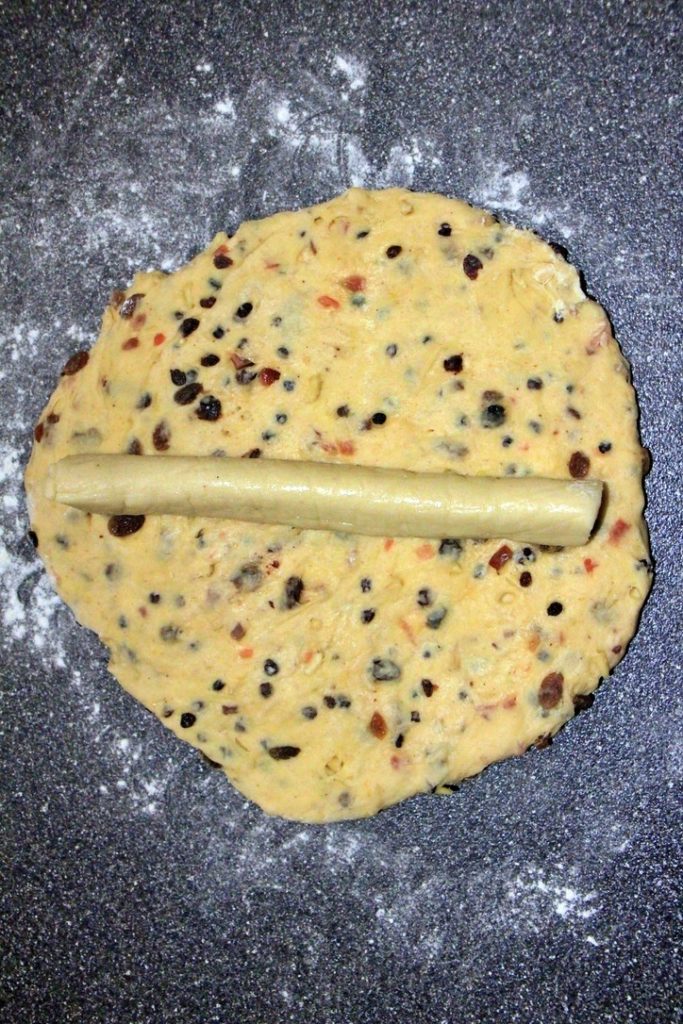 Rolled out dough with marzipan for stollen