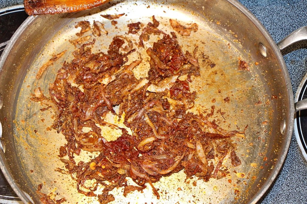 Onions and spices in a pan