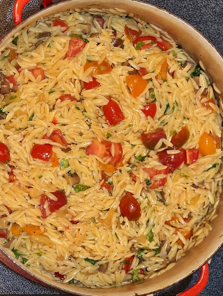 Orzo and tomatoes in a pan