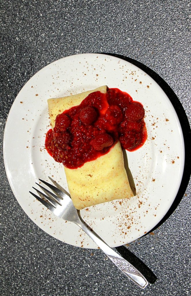 Unopened blintz with compote