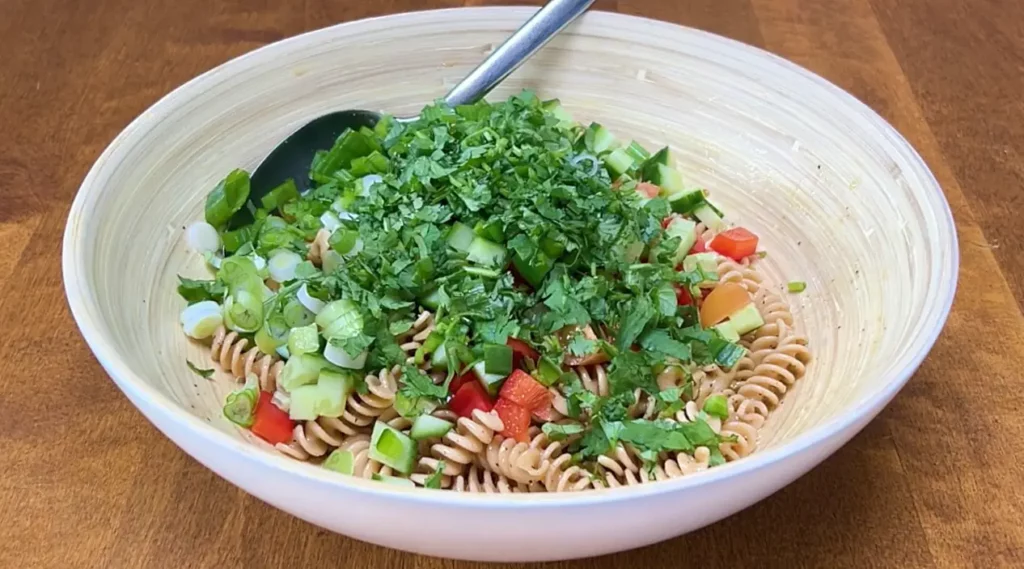 Pasta salad ingredients in bowl
