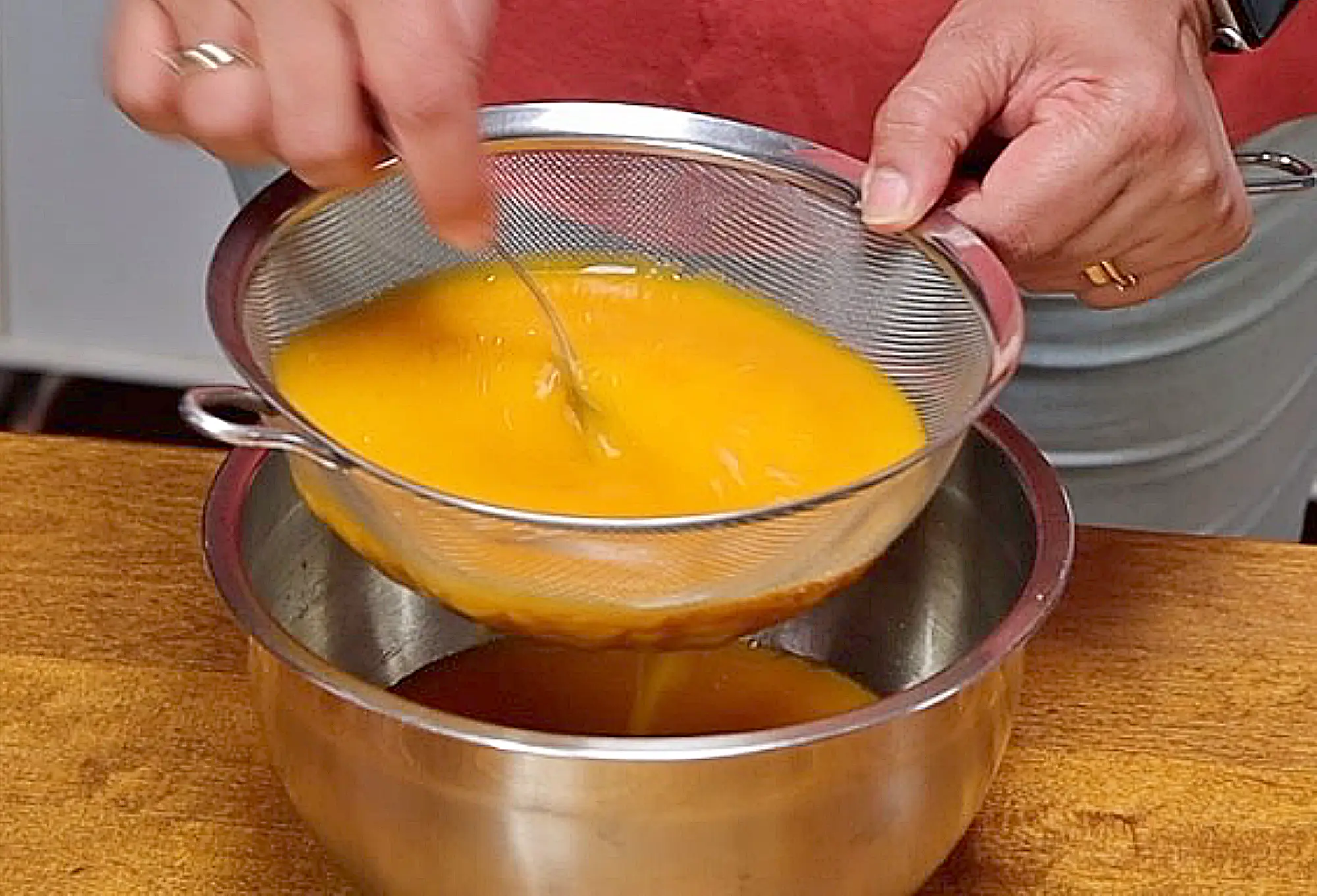 Mango agua fresca through sieve